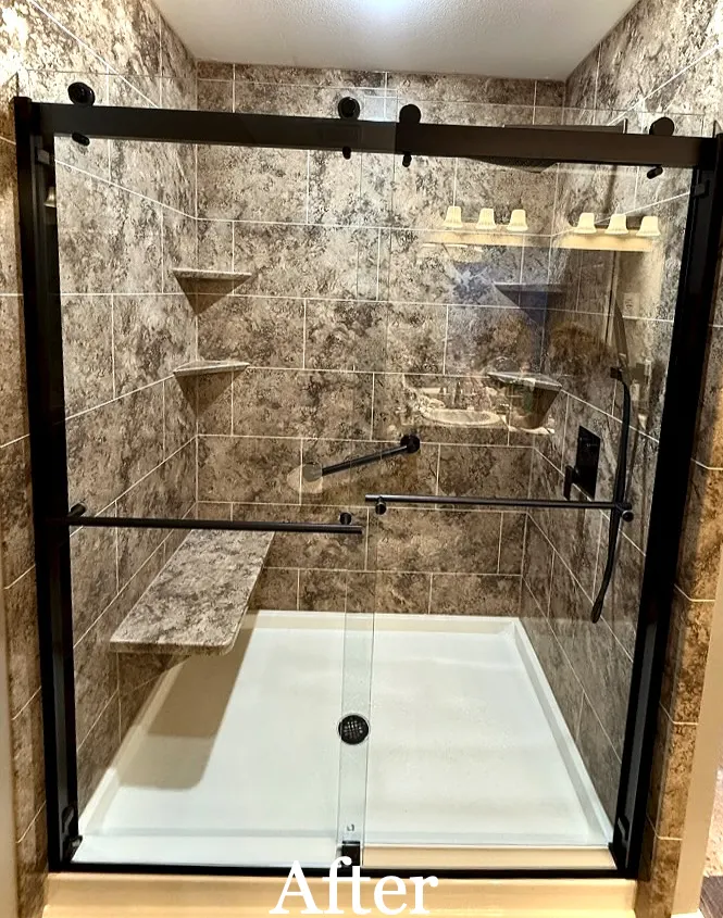 After: AFTER: stone look shower, black framed sliding door, shelves