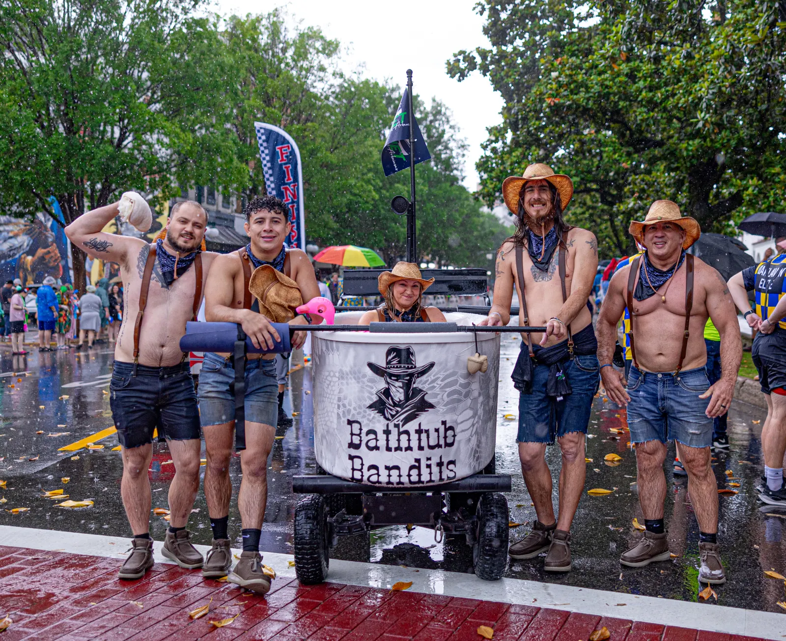 Bathtub Bandits team posed in rain with tub float