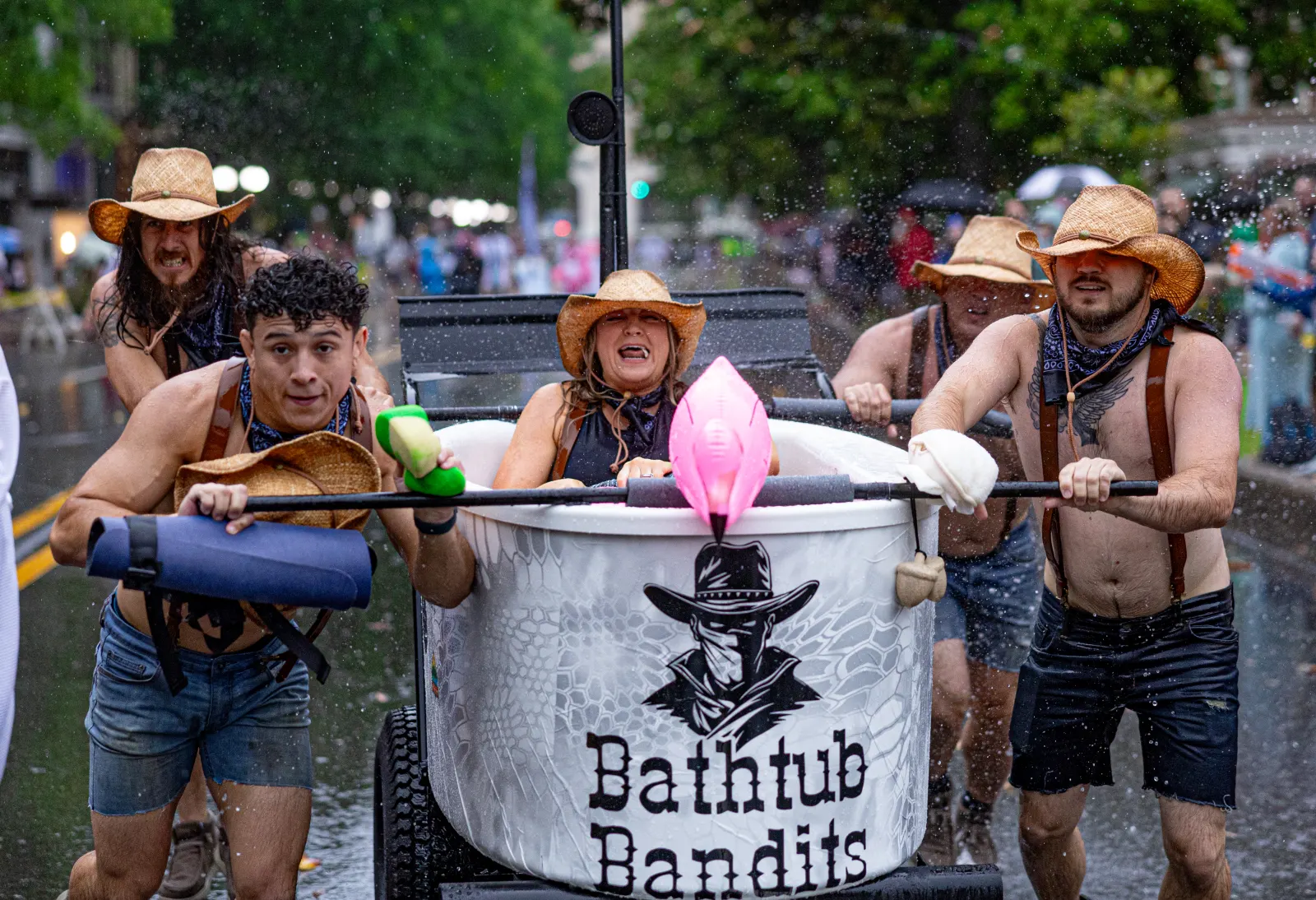 Bathtub Bandits team pulling tub float