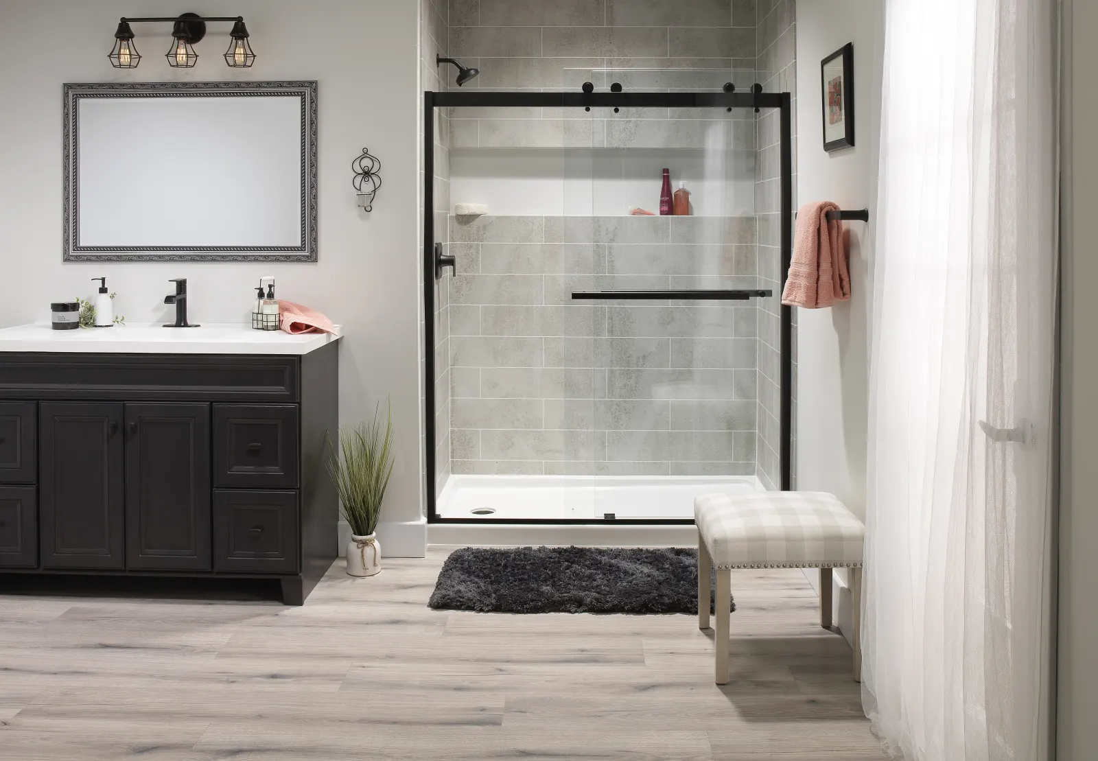 Black frame shower with dark vanity