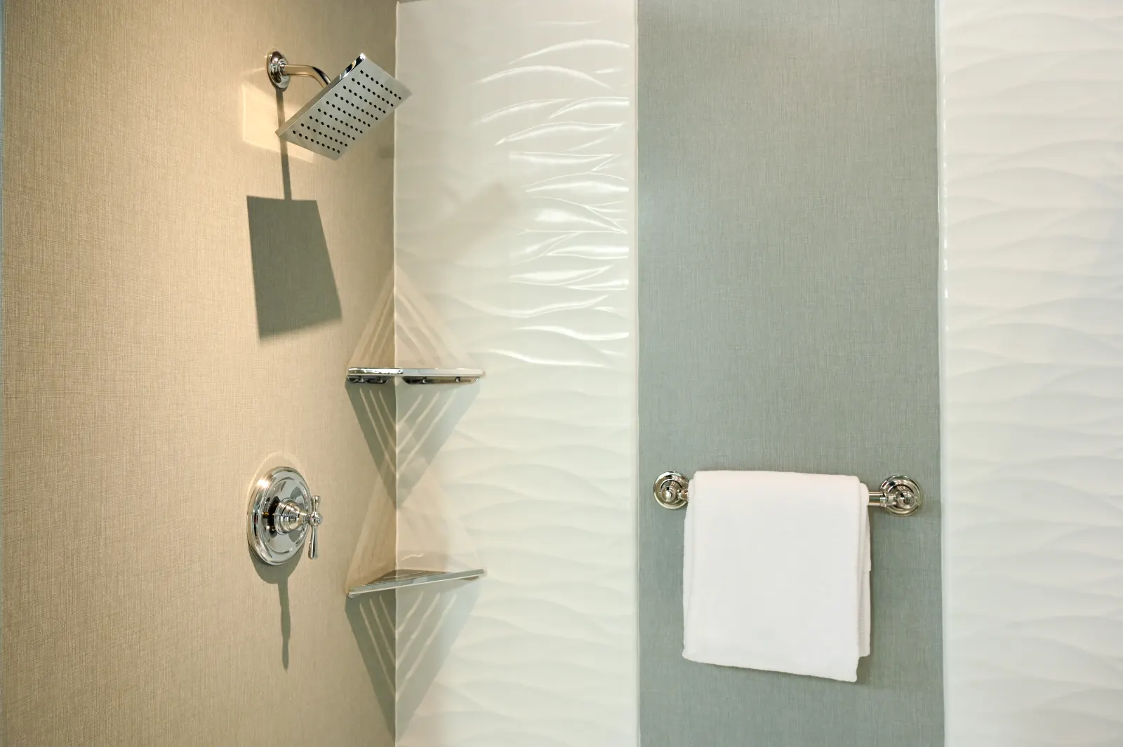 Chrome rain shower, corner shelves, towel bar on wavy wall panels