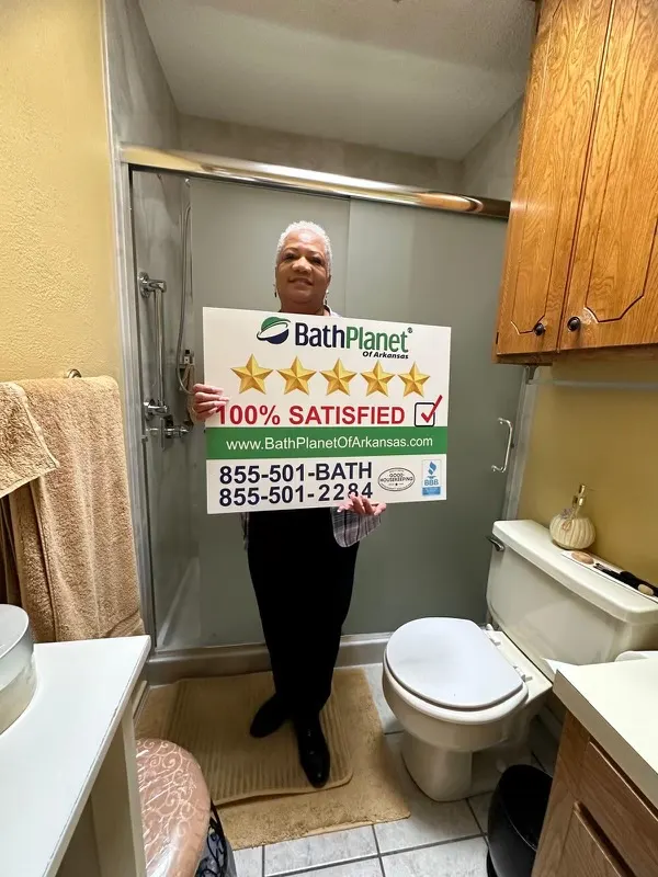 Customer with 5 star sign in glass door shower