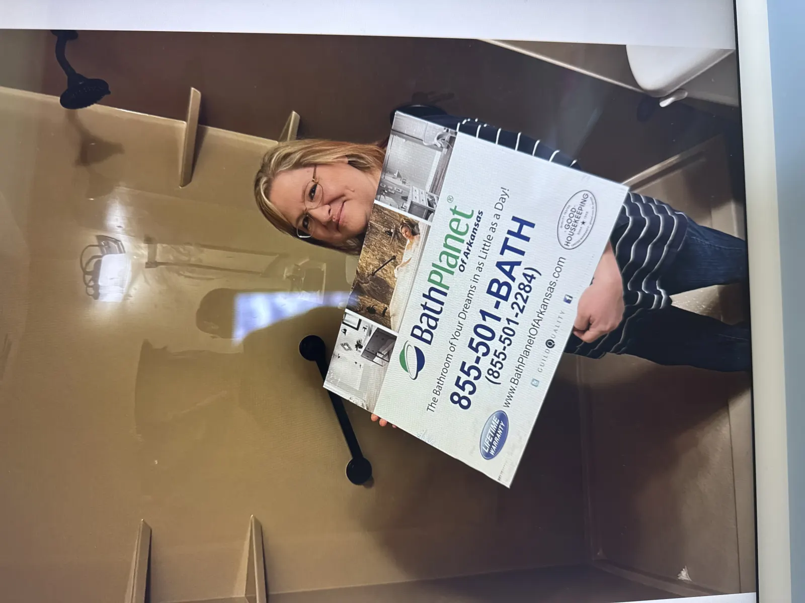 Customer with Bath Planet 855-501 BATH sign in shower