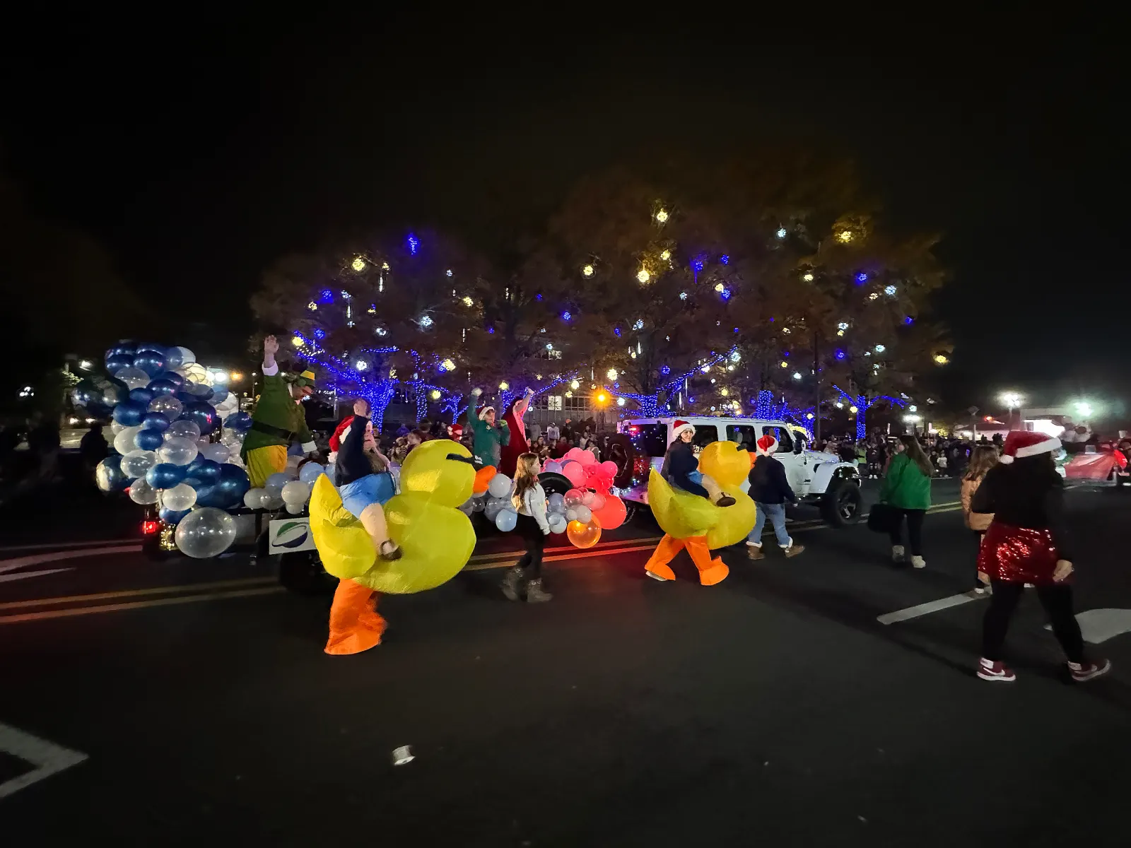 Night Christmas parade, inflatable ducks