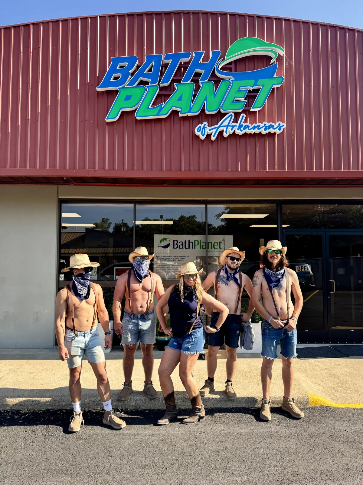 Show team in costumes in front of Bath Planet storefront