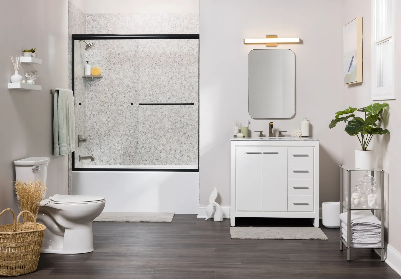 Shower and tub with black framed door, white vanity