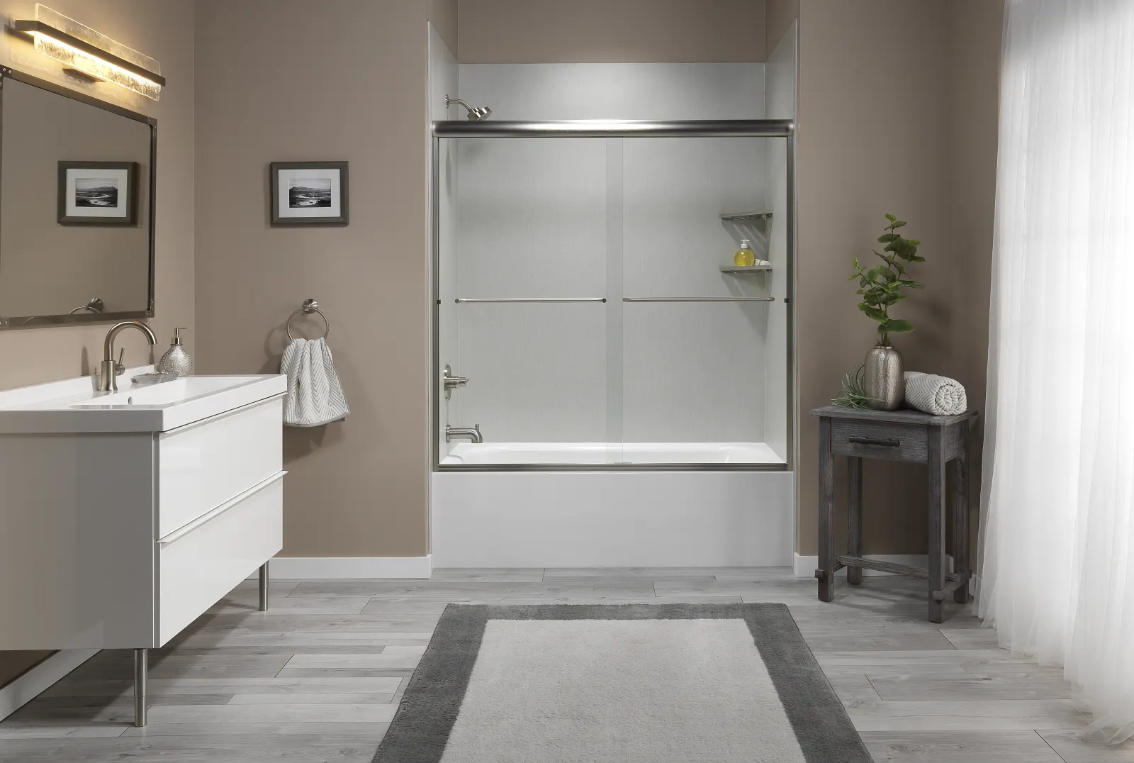 Sliding glass tub door with white vanity