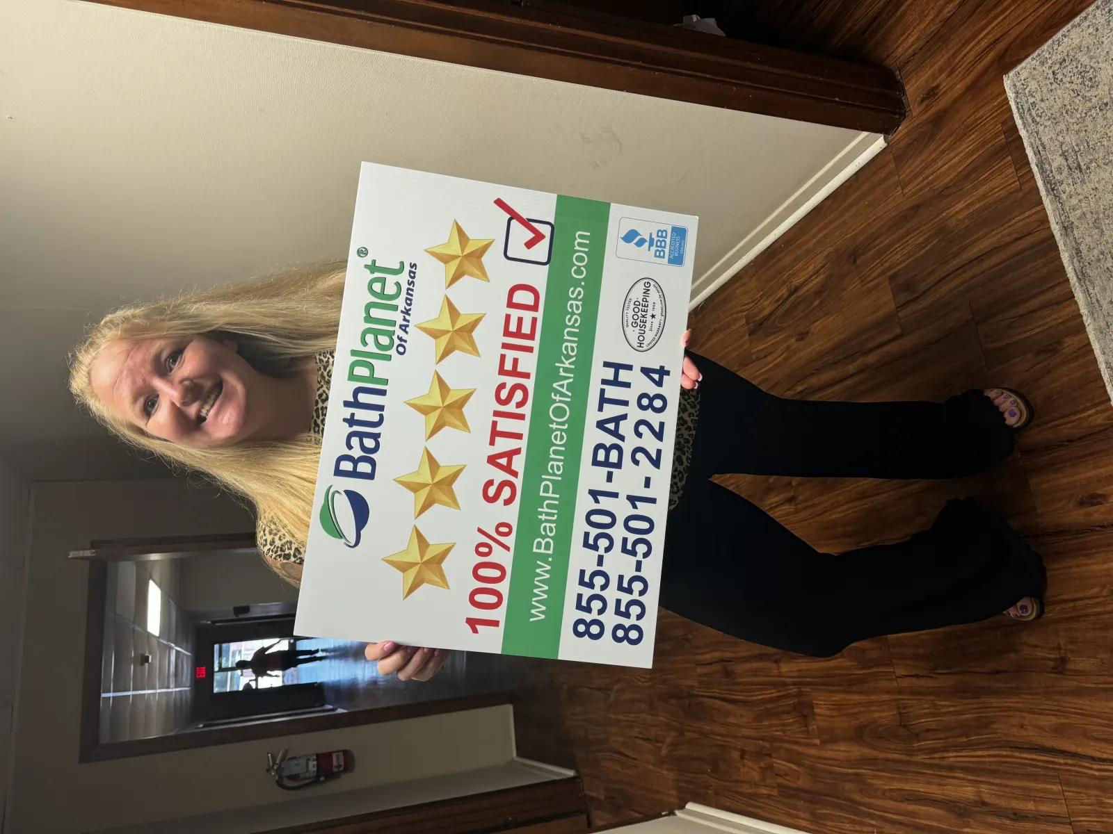 Smiling woman with 5 star sign