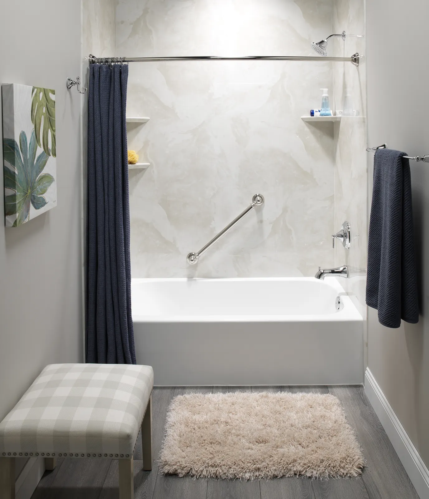 Tub and shower with marble look wall, plaid bench