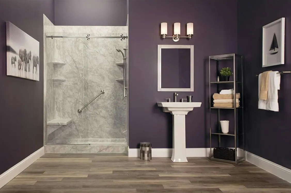 Walk in shower with purple wall, pedestal sink